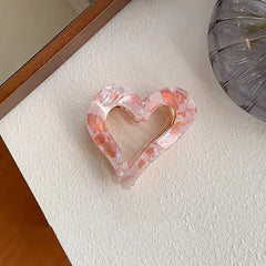 Close-up showing the material and craftsmanship of the Pink Heart Hair Clips