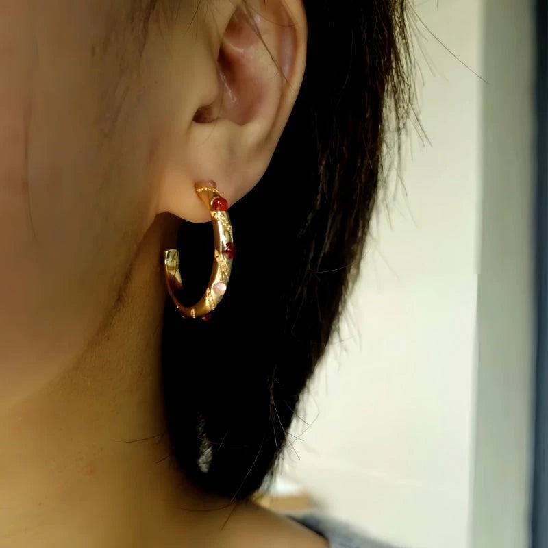 Close-up detail of the sparkling zircons and plating on the C-Shaped Earrings