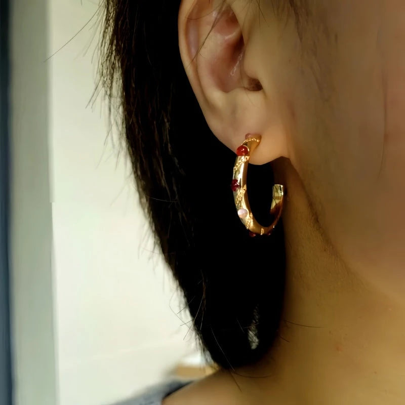 Model showcasing the dangle and style of the 18K Gold-Plated Agate C-Shaped Earrings