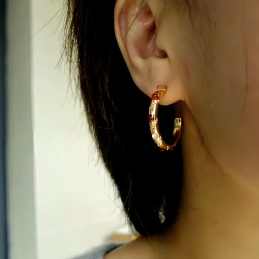 Model showcasing the dangle and style of the 18K Gold-Plated Agate C-Shaped Earrings