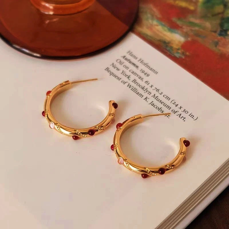 Angled view of the 18K Gold-Plated Agate C-Shaped Earrings
