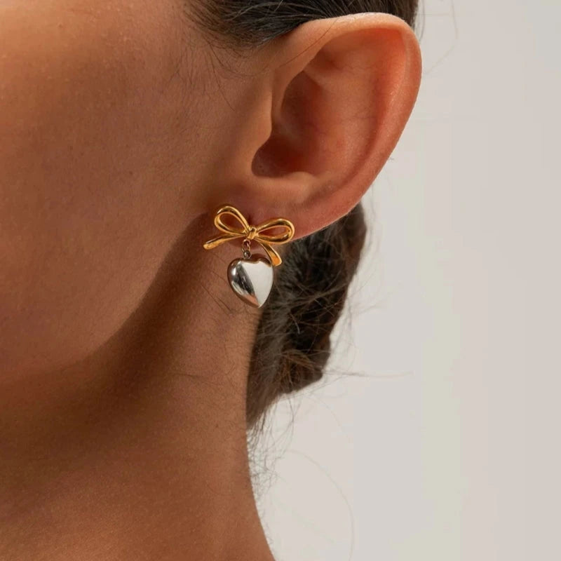 Close-up detail of the sparkling zircons and plating on the Bow Heart Earrings