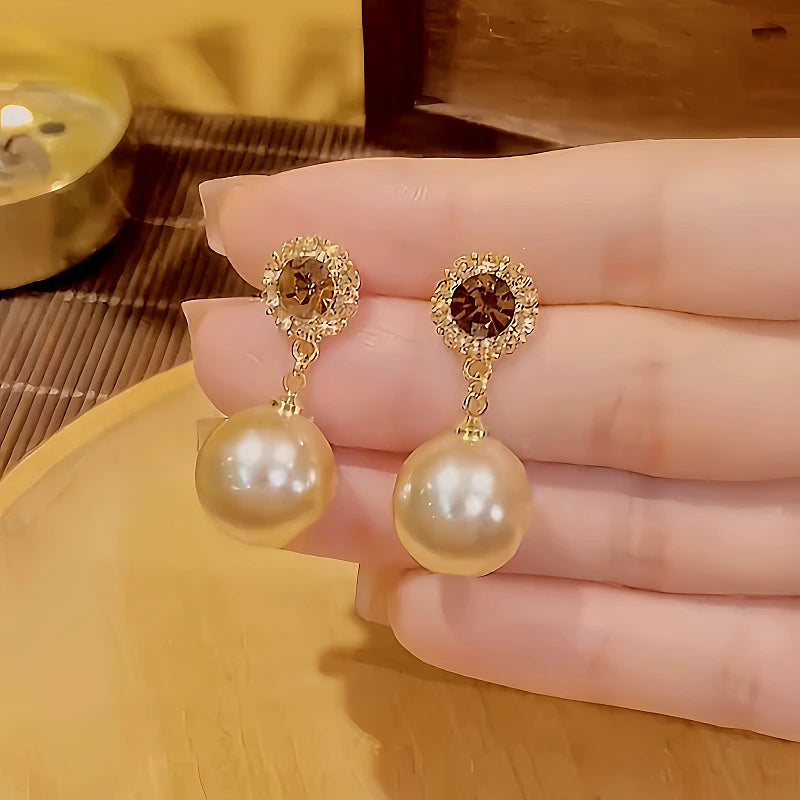 Close-up detail of the sparkling zircons and plating on the Pearl Earrings
