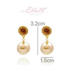 Angled view of the 18K Gold-Plated Brown Diamond Pearl Earrings