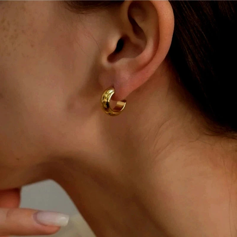 Model showcasing the dangle and style of the 18K Gold-Plated C-Shaped Earrings