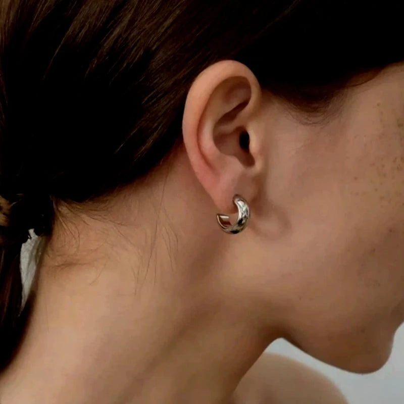 Close-up detail of the sparkling zircons and plating on the C-Shaped Earrings