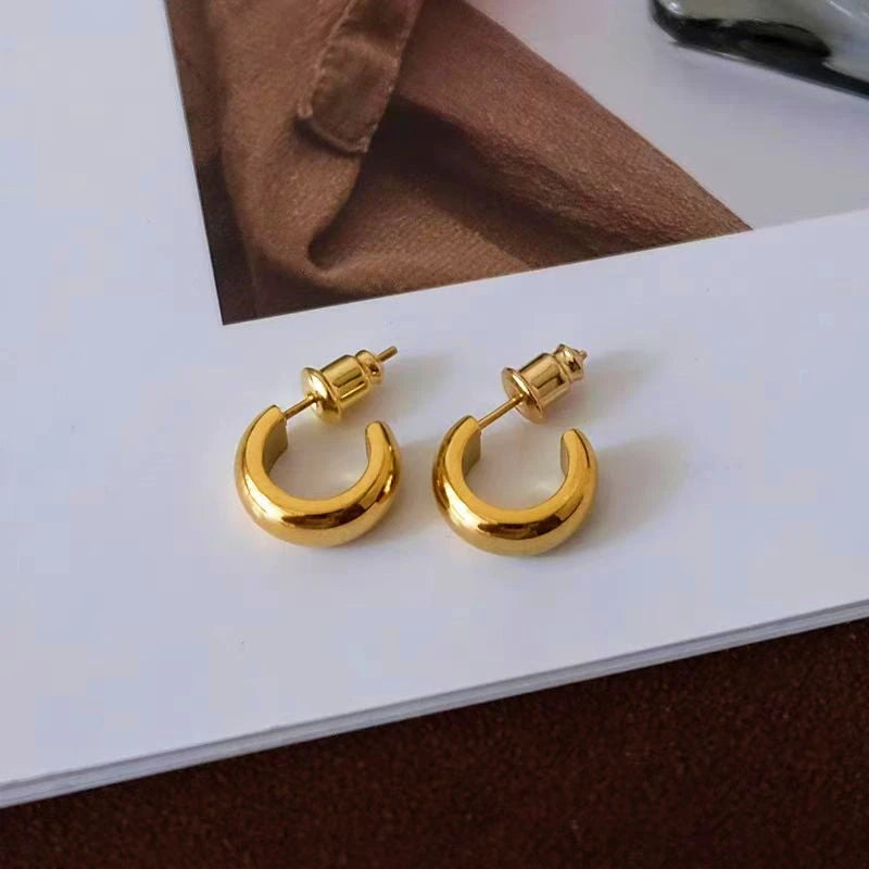 Angled view of the 18K Gold-Plated C-Shaped Earrings