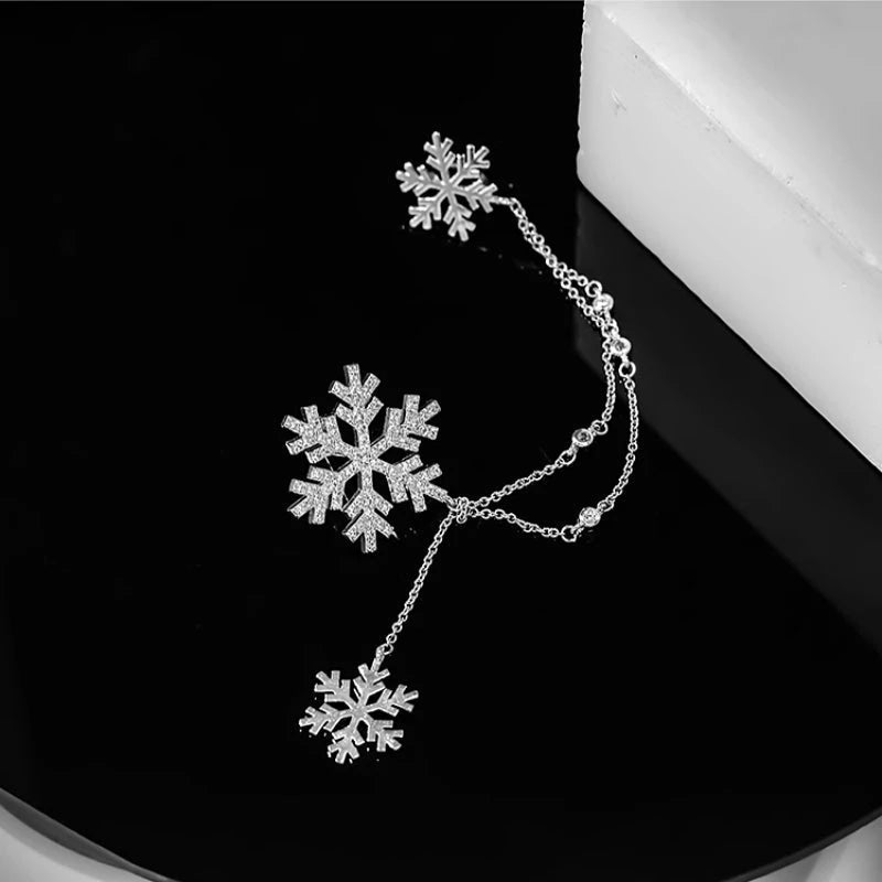 Angled view of the 18K Gold-Plated Christmas Snowflake Ear Clip Earrings