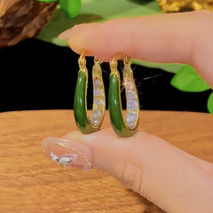 Close-up detail of the sparkling zircons and plating on the Green Oil Drop Earrings