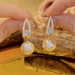 Close-up detail of the sparkling zircons and plating on the Pearl Drop Earrings