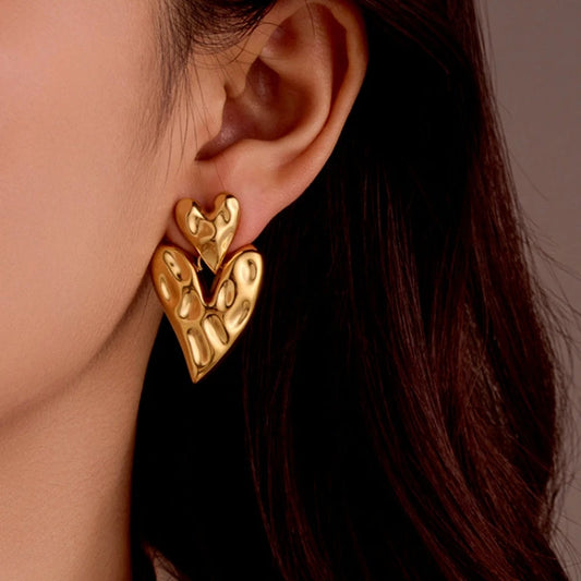 Model showcasing the dangle and style of the 18K Gold-Plated Double-Heart Earring