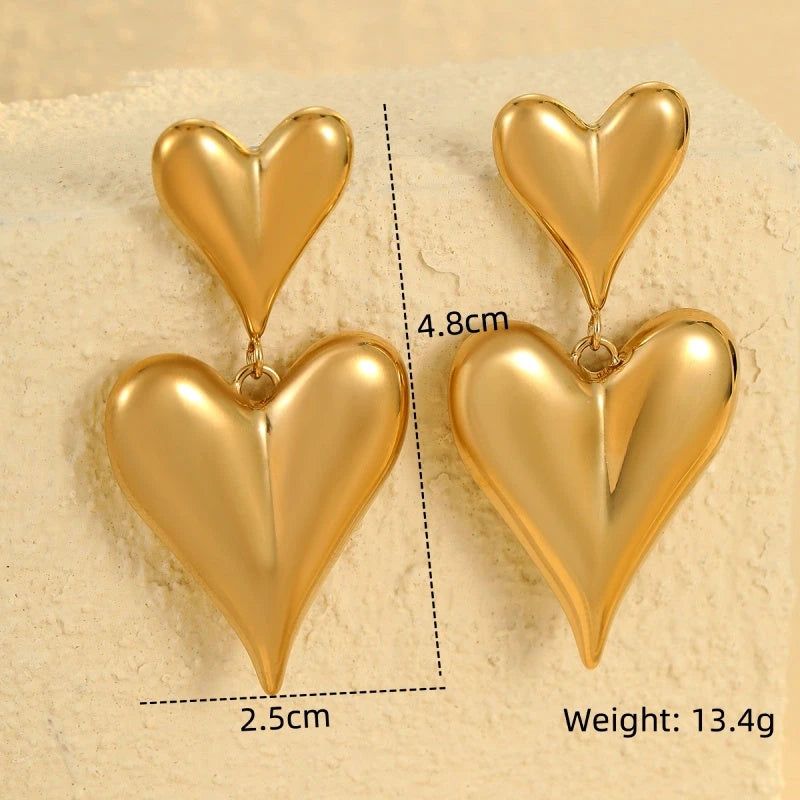 Close-up detail of the sparkling zircons and plating on the Double-Heart Earrings