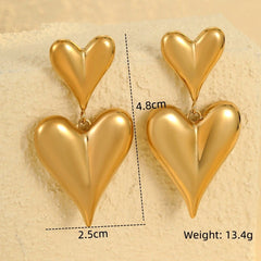 Close-up detail of the sparkling zircons and plating on the Double-Heart Earrings