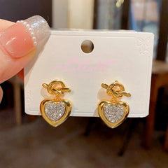 Angled view of the 18K Gold-Plated Elegant Knotted Diamond Heart Earrings