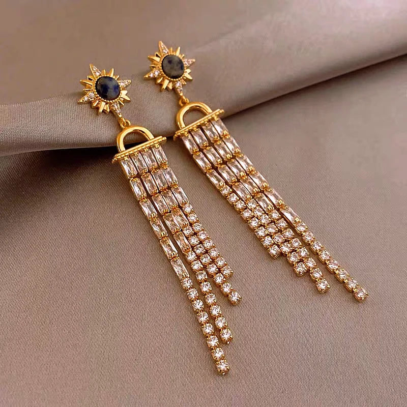Close-up detail of the sparkling zircons and plating on the Tassel Earrings