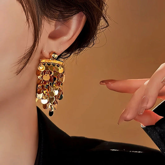 Model showcasing the dangle and style of the 18K Gold-Plated Elegant Tassel Earrings