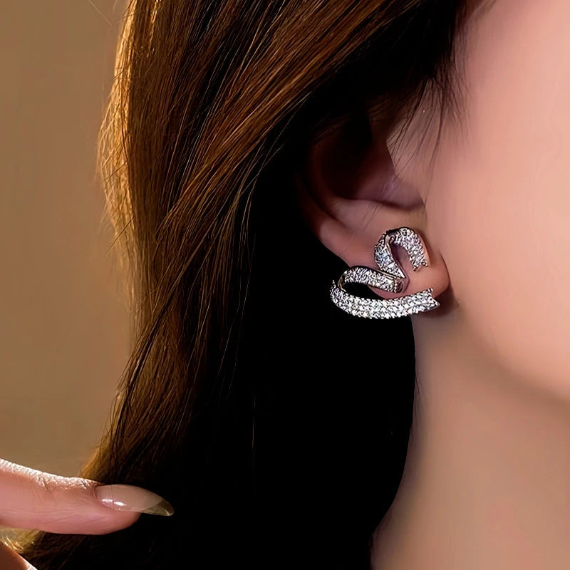 Model showcasing the dangle and style of the 18K Gold-Plated Elegant Zircon Heart Studs