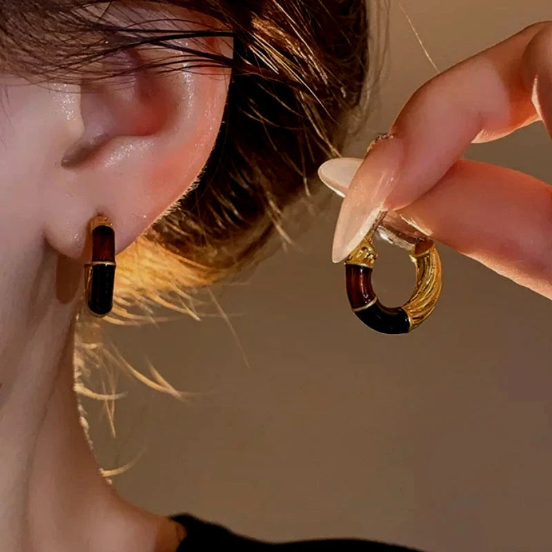 Close-up detail of the sparkling zircons and plating on the Drip Earrings