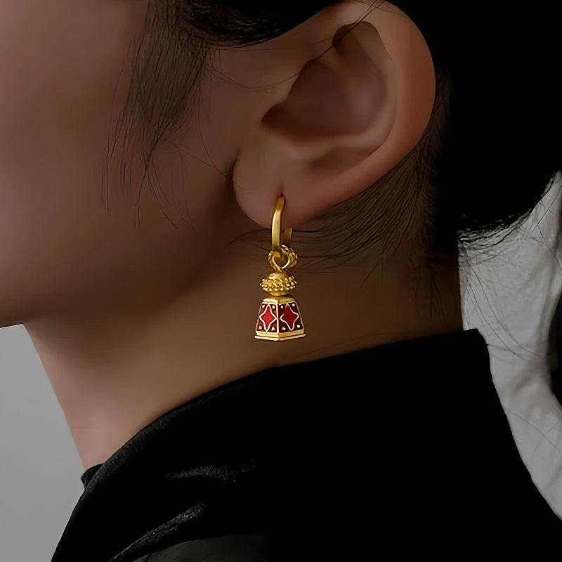 Model showcasing the dangle and style of the 18K Gold-Plated Enamel Drip Glaze Bell-Shaped Earrings