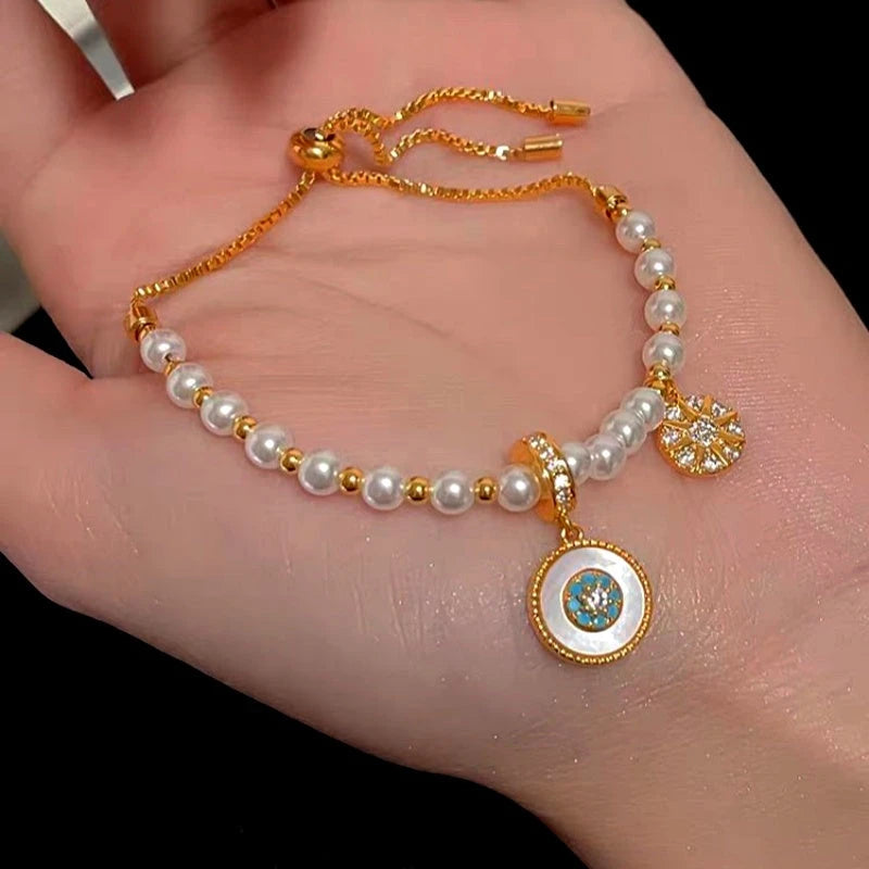 Close-up of the clasp and charm details on the Pearl Bracelet
