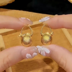 Close-up detail of the sparkling zircons and plating on the Bead Earrings