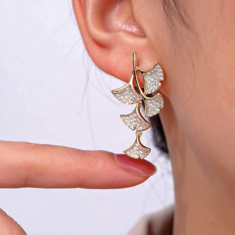 Angled view of the 18K Gold-Plated Ginkgo Leaf Earrings