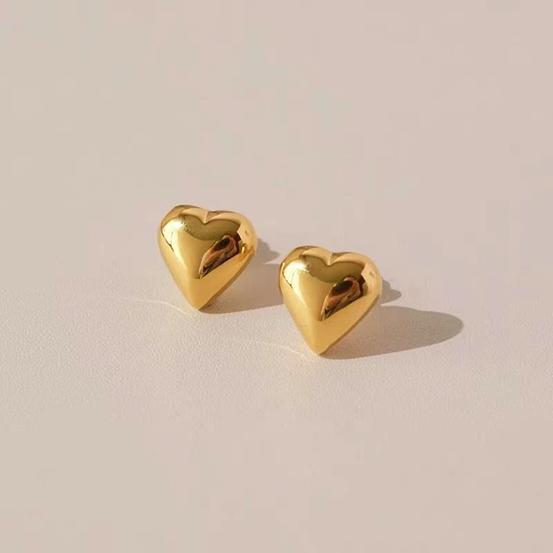 Angled view of the 18K Gold-Plated Heart Stud Earrings