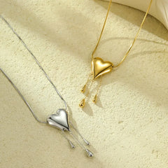 18K Gold-Plated Heart Tassel Necklace worn to showcase its length and pendant detail