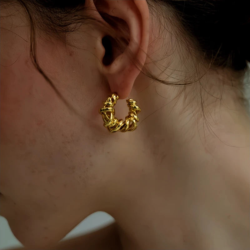 Angled view of the 18K Gold-Plated Hollow C-Shaped Earrings