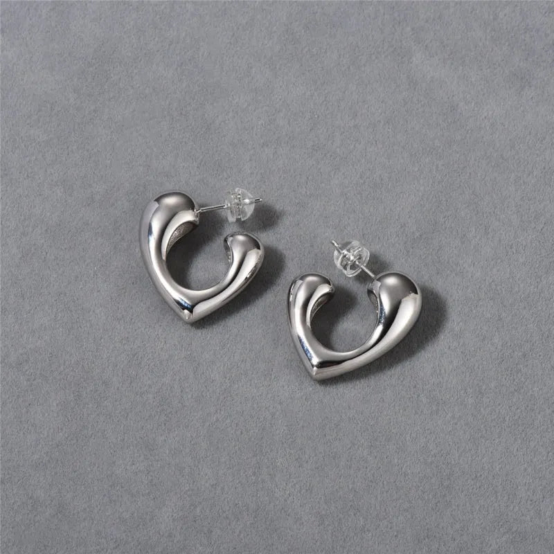 Close-up detail of the sparkling zircons and plating on the Heart-Design Earrings