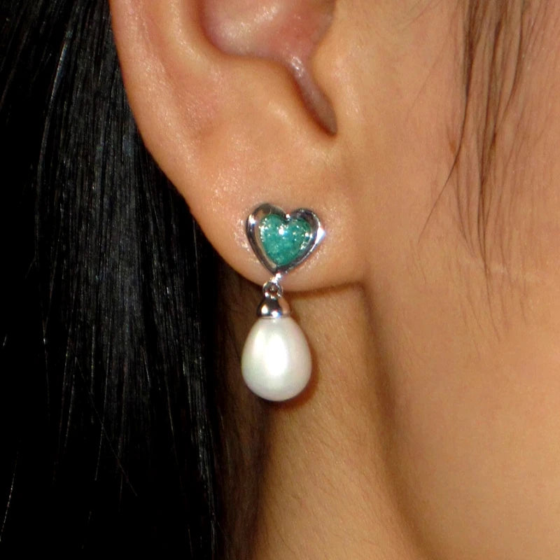 Angled view of the 18K Gold-Plated Ice Crystal Heart Pearl Earrings