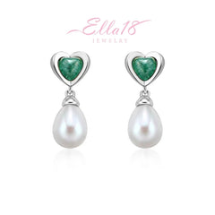 Model showcasing the dangle and style of the 18K Gold-Plated Ice Crystal Heart Pearl Earrings