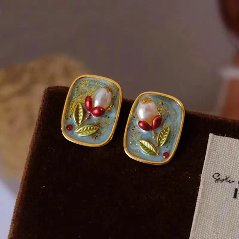 Model showcasing the dangle and style of the 18K Gold-Plated Natural Pearl Flower Stud Earrings