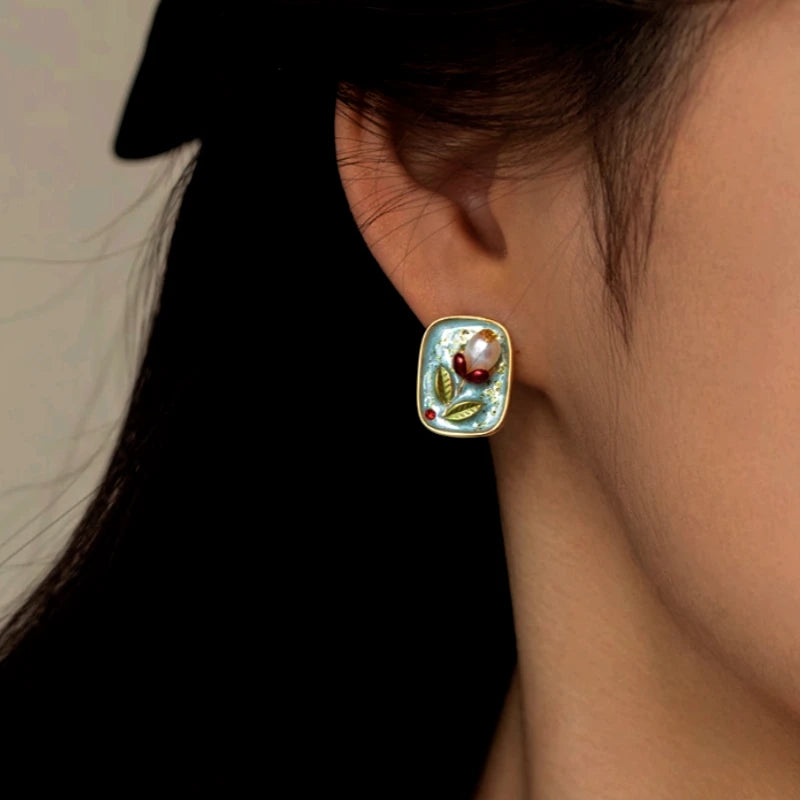 Angled view of the 18K Gold-Plated Natural Pearl Flower Stud Earrings