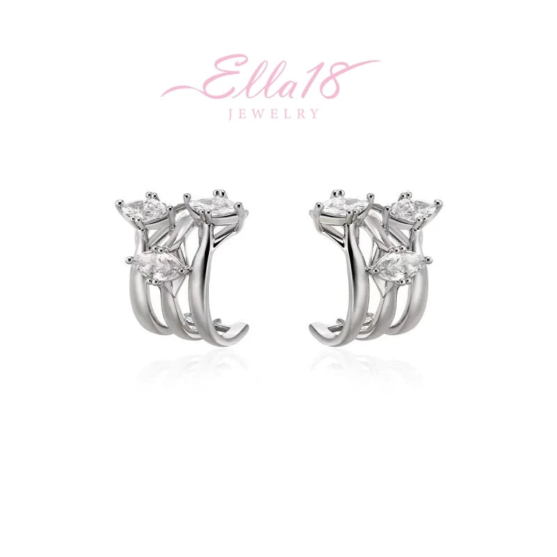 Model showcasing the dangle and style of the 18K Gold-Plated Three-Layer Zircon Stud Earrings