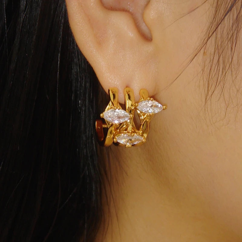 Close-up detail of the sparkling zircons and plating on the Layer Zircon Stud Earrings