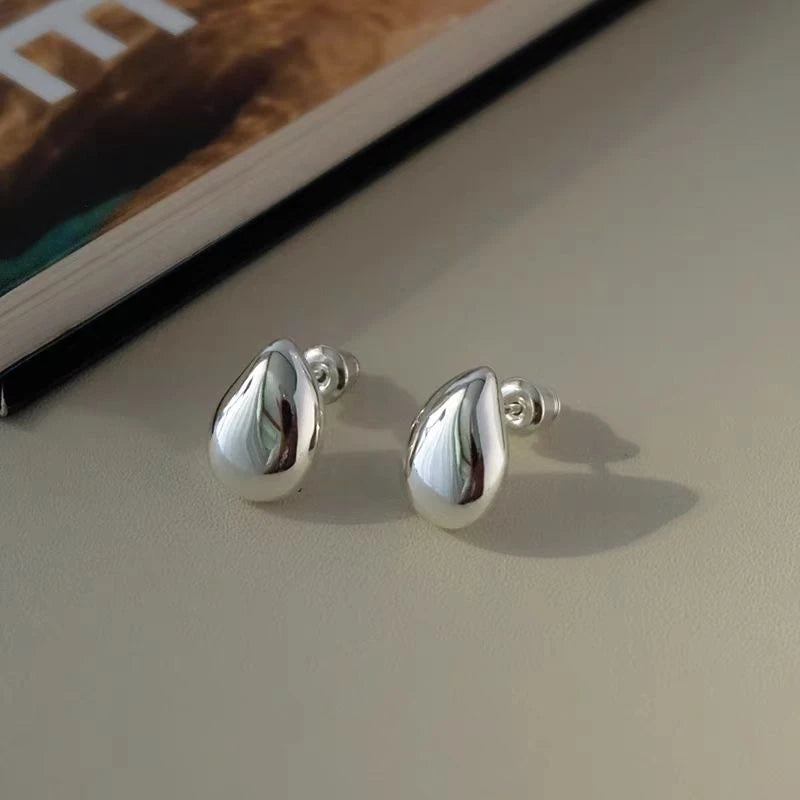 Close-up detail of the sparkling zircons and plating on the Water Drop Stud Earrings