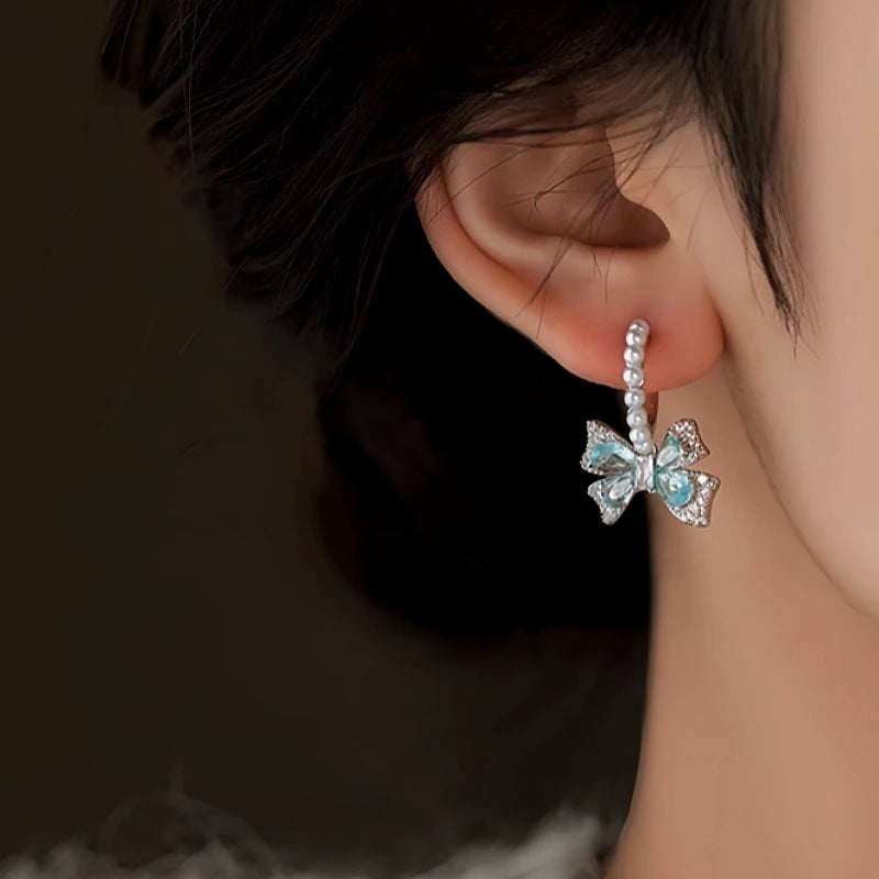 Close-up detail of the sparkling zircons and plating on the Pearl Earrings