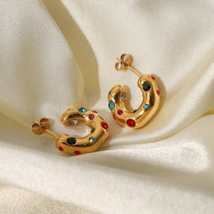 Angled view of the 18K Gold-Plated Zircon C-Shaped Earrings