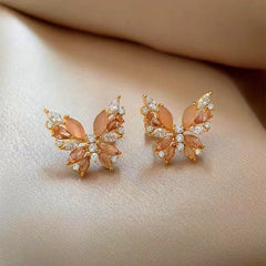 Angled view of the 18K Gold-Plated Zircon Cat's Eye Stone Butterfly Earrings