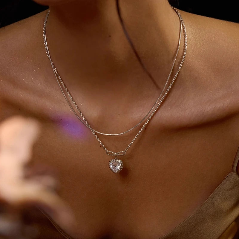 18K Gold-Plated Zircon Heart Bow Necklace worn to showcase its length and pendant detail