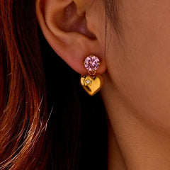 Model showcasing the dangle and style of the 18K Gold-Plated Zircon Heart Earrings