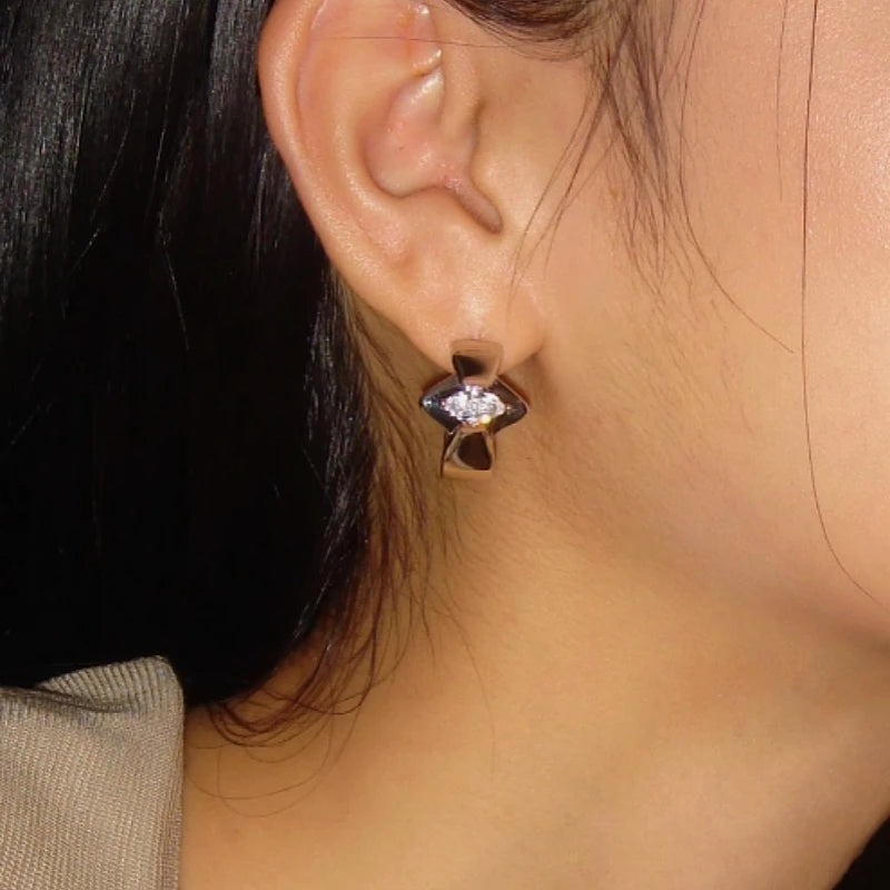 Model showcasing the dangle and style of the 18K Gold-Plated Zircon Hoop Earrings