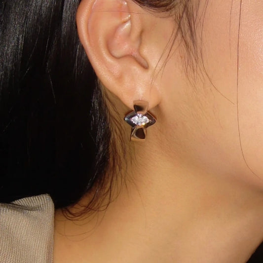 Model showcasing the dangle and style of the 18K Gold-Plated Zircon Hoop Earrings