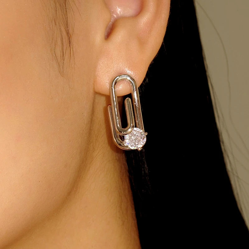 Silver paperclip cubic zirconia stud earring on ear side view