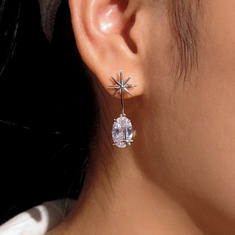 Angled view of the 18K Gold-Plated Zircon Star Earrings