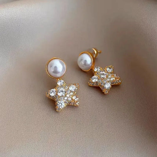 Model showcasing the dangle and style of the 18K Gold-Plated Zircon Star Pearl Earrings
