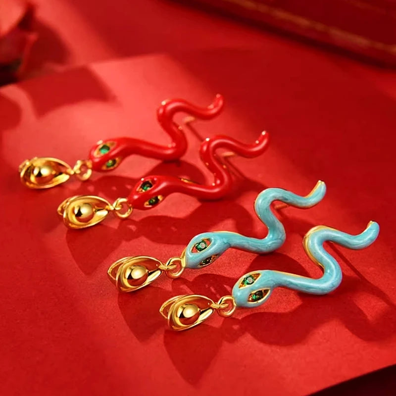 Close-up detail of the sparkling zircons and plating on the Snake Earrings
