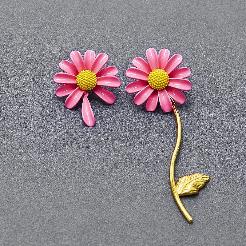Model showcasing the dangle and style of the 24K Gold-plated Asymmetrical Daisy Flower Earrings