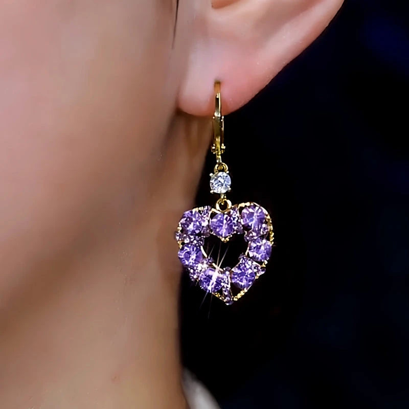 Close-up detail of the sparkling zircons and plating on the Purple Zircon Heart Earrings